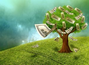 A money tree on top of a green hill symbolises financial freedom.