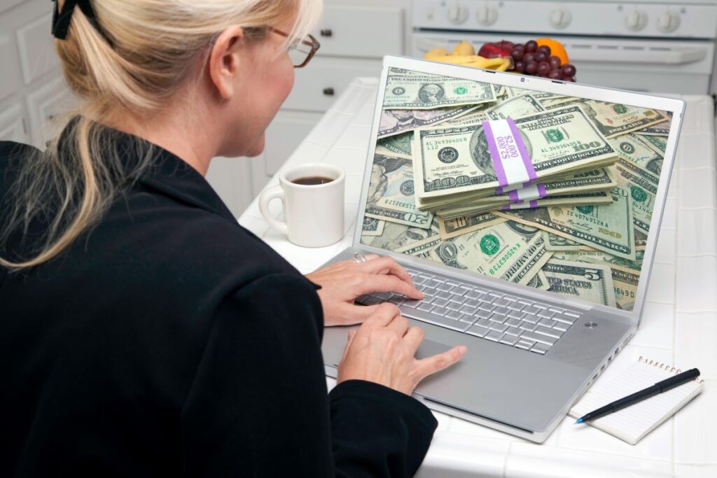 A woman on her laptop searching to make money online