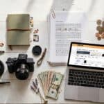 Flat-lay of creative tools representing different online income ideas like writing, design, and photography